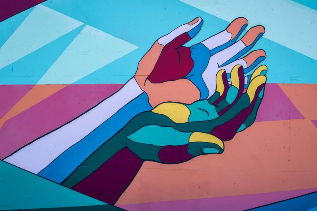 A mural of two hands.